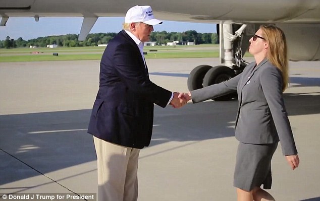At One Point In The Footage Trump Is Seen Shaking Hands With A Businesswoman