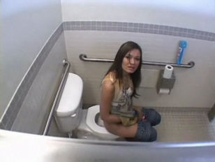 Brunette blowing dicks on toilet