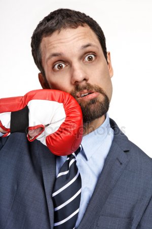Close Up Young Business Man Struck Hand In Boxing Glove Isolated On White Background