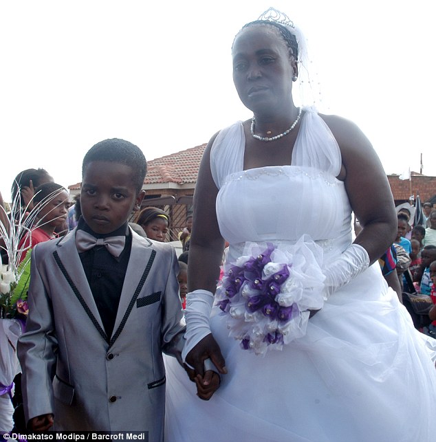 Eight Year Old Sanele Masilela Posing With His Year Old Bride