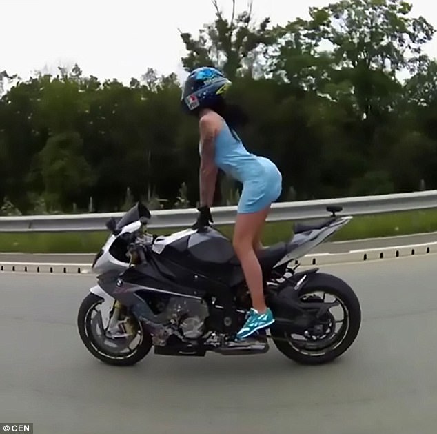 In One Video She Is Seen Riding Sideways On Her Bike Wearing Just A Short