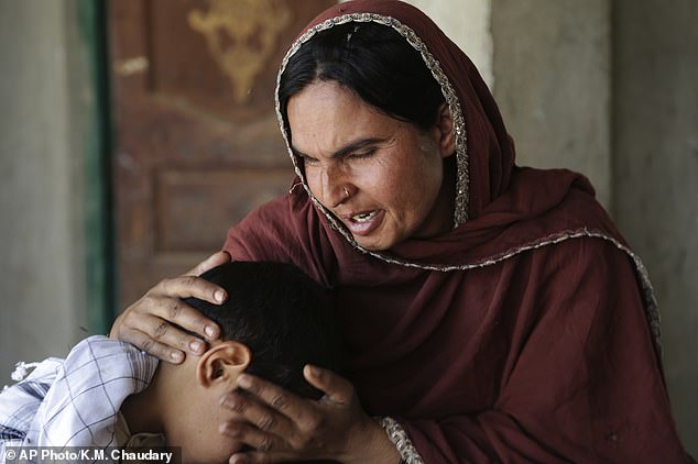 Kausar Parveen Comforts Her Child Who Was Allegedly Raped A Mullah Or Religious Cleric