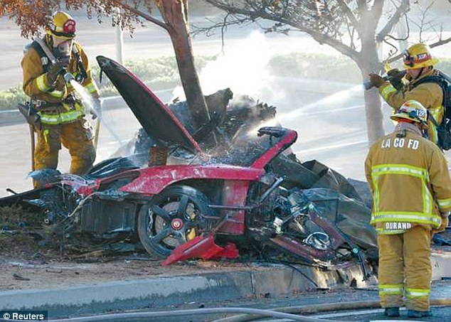Mangled Firefighters Stand The Wreckage Of The Crash In Which Paul Walker And His