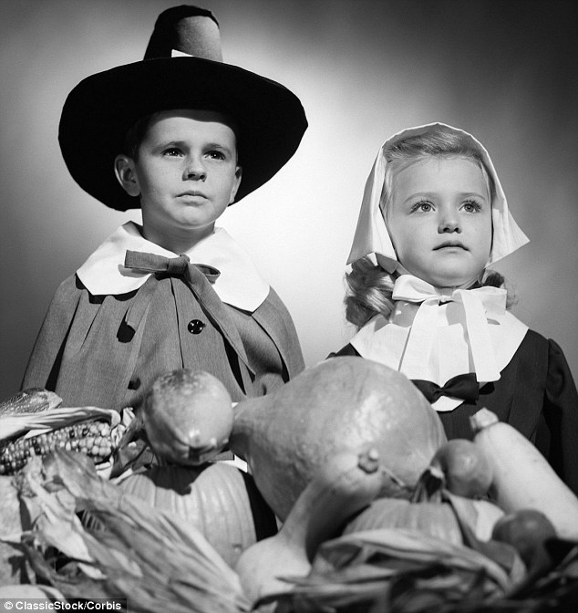 Pilgrims Progress A Boy And Girl Pose In Their Thanksgiving Costumes With A Harvest Table