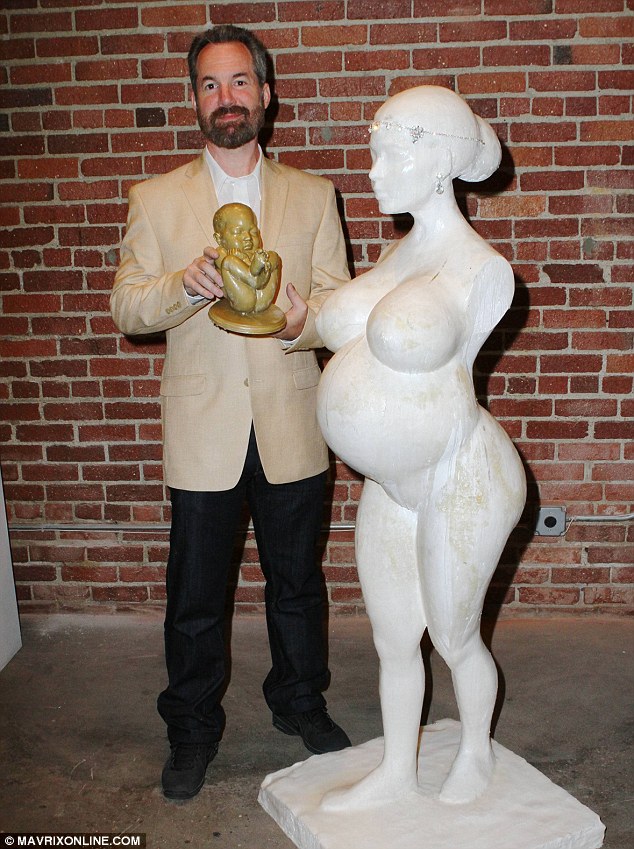 Replica Edwards Posed For A Snap Cradling His Depiction Of Kim And Kanye Wests Unborn