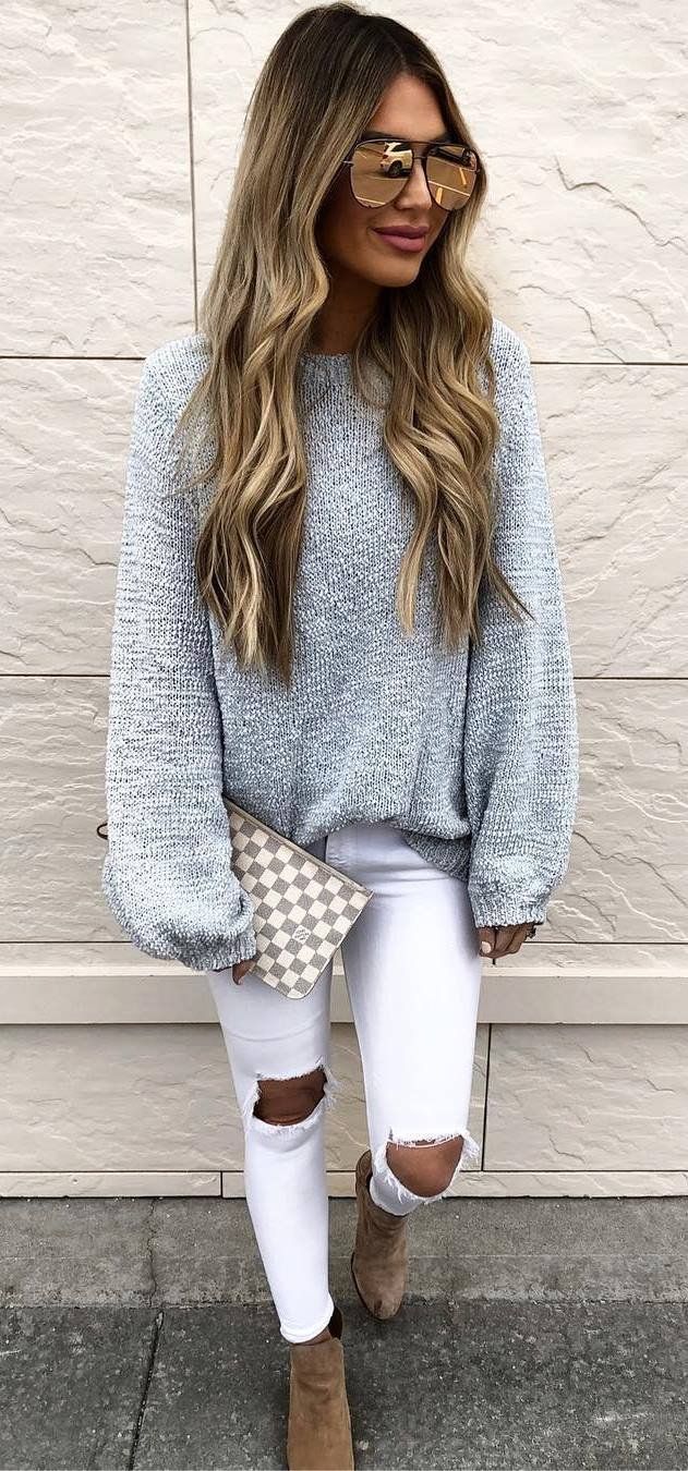 Spring Outfit Idea Grey Sweater Clutch White Ripped Jeans Boots