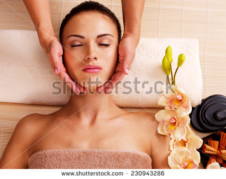 Stock Photo Masseur Doing Massage The Head Of An Adult Woman In The Spa Salon