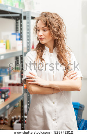 Stock Photo Woman Doctor Looking Away From The Camera Inside The Warehouse 1