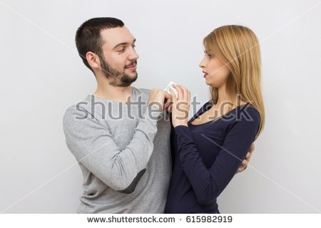 Stock Photo Young Happy Couple Posing On Light Gray Background Hold A Condom In Hands
