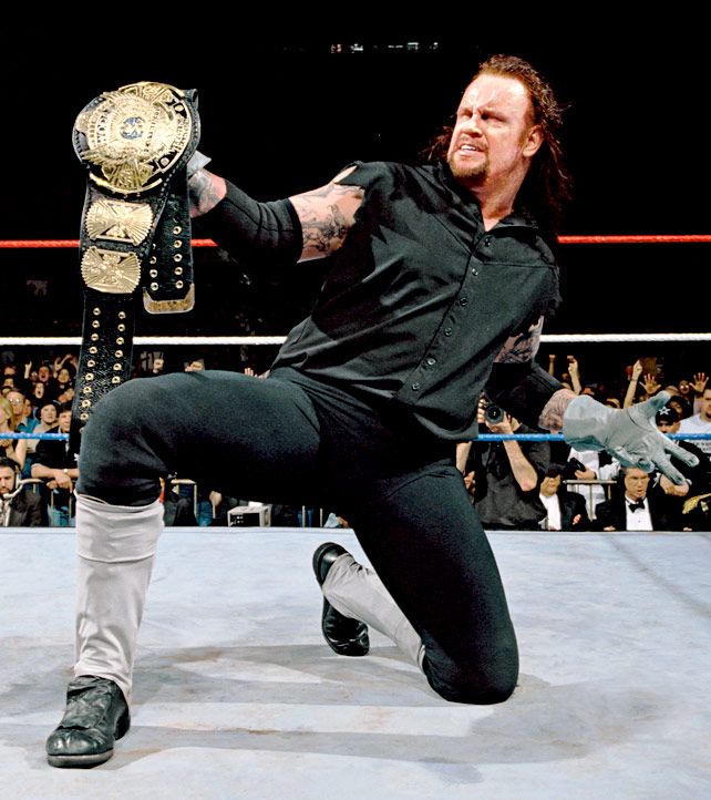 The Undertaker Holding Up The Championship After Defeating Sycho Sid At Wrestlemania The Streak Was