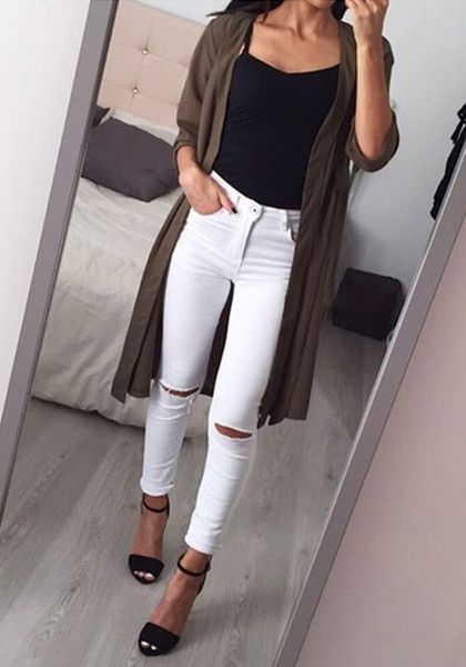 This Classic White Ripped Skinny Jeans Is Styled With Distressed Detailing In The Knee Areas