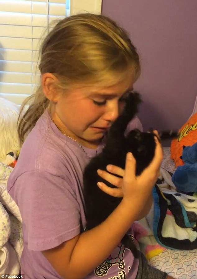 Thrilled She Cradled The Black Kitty Who Was A Rescue In Her Arms