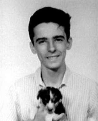 Young Alice Cooper Holding A Puppy Picture